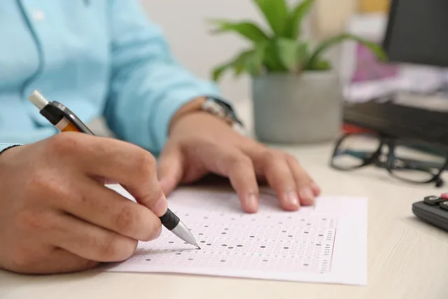 test paper, answering, hand, note, filling sheet, filling form, test paper, test paper, test paper, test paper, test paper. Write the employer scenario first, then let payroll software prove it can handle it